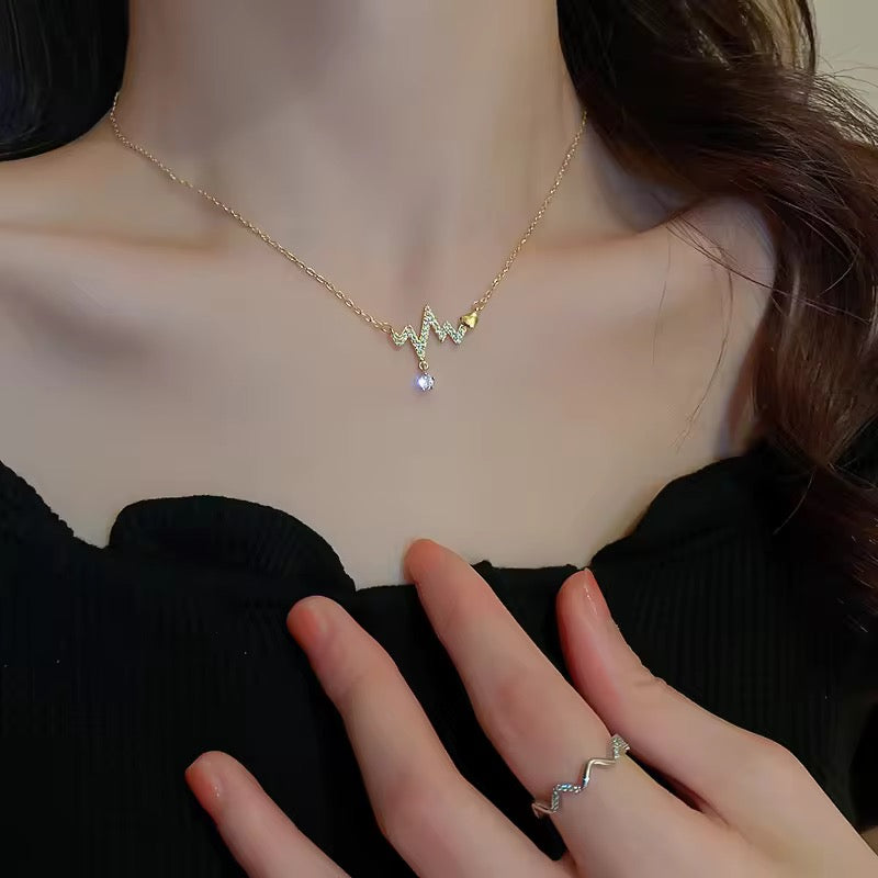 Minimalist gold necklace with heartbeat line pendant, anti-tarnish stainless steel, ideal for daily styling