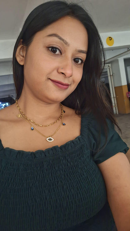 Gold evil eye necklace with minimalist design in anti-tarnish stainless steel, perfect for daily layering

