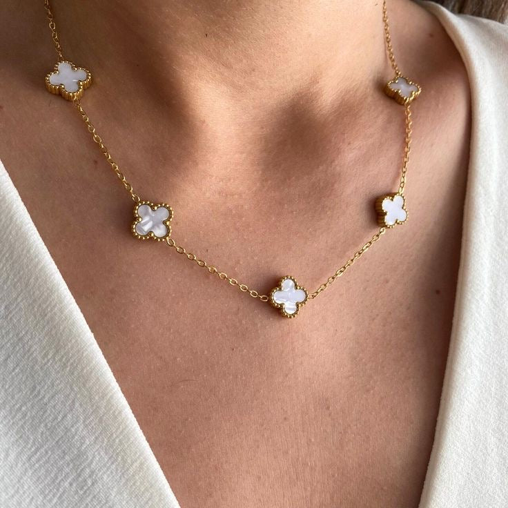 Anti-tarnish gold clover necklace with mixed black and white enamel charms for daily wear and gifting