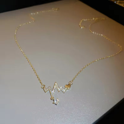Heartbeat necklace featuring sleek heartbeat design in gold-plated stainless steel, perfect for everyday wear