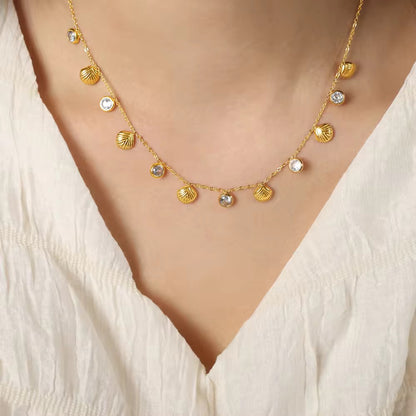 Gold charm necklace with shell and crystal drops, 18k plated design perfect for beach days or casual wear