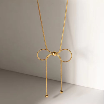Dainty bow charm necklace with polished gold finish, sweatproof and perfect for everyday minimal styling