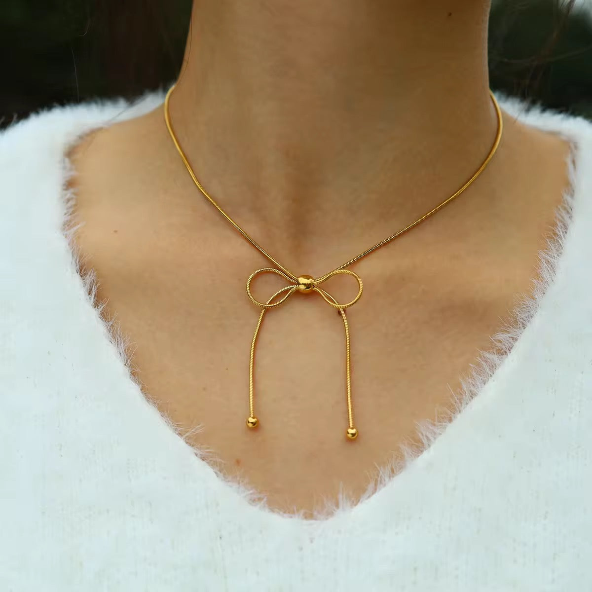 18K gold plated bow pendant necklace in anti-tarnish stainless steel for office outfits or evening looks