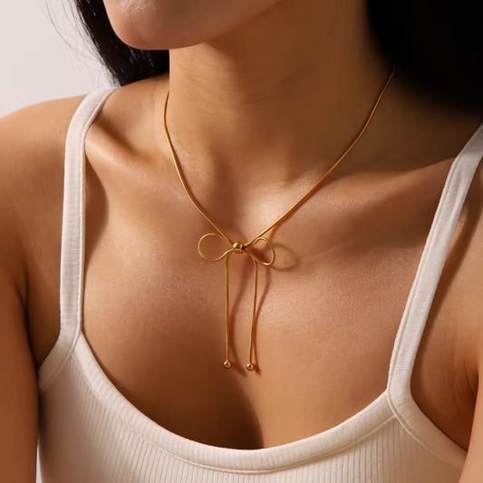 Gold bow knot necklace with elegant minimal design in waterproof stainless steel for daily and casual wear