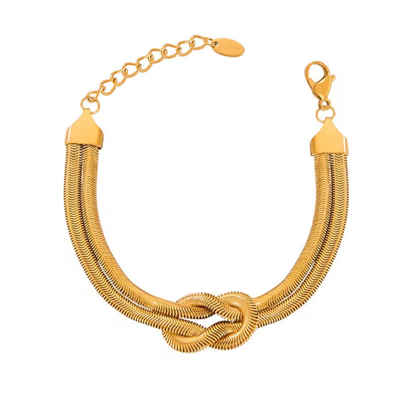 Chunky gold layered knot bracelet – trendy women’s fashion accessory, elegant arm candy.