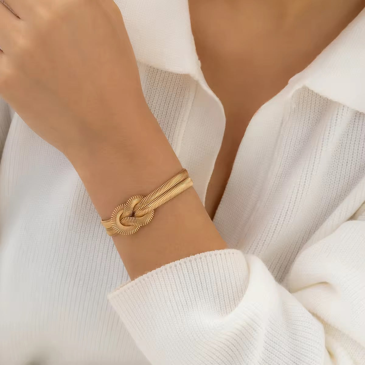 Modern gold love knot bracelet with dual snake chains – waterproof and anti-tarnish design.
