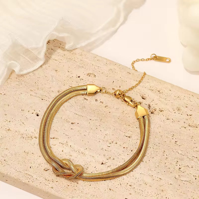Double chain gold knot bracelet – modern stacking bracelet, luxe and adjustable fit.