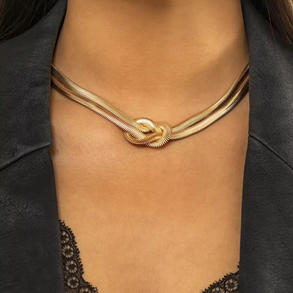 Bold gold choker necklace with dual chain and knot style, sweatproof and perfect for simple elegant outfits