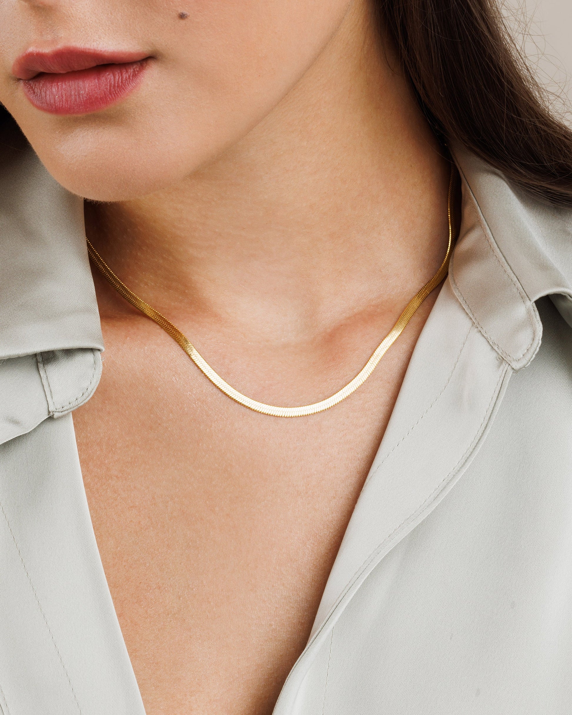 Sleek flat snake chain necklace in gold, rose gold, silver tones for layering and casual wear
