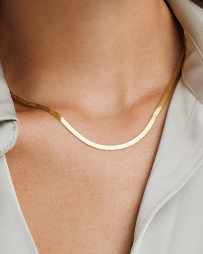 Gold snake chain necklace with flat shimmer design in waterproof stainless steel for daily and office wear